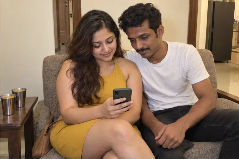 Rentadolls.net girl showing her client a photo on her phone on her second visit in Bangalore